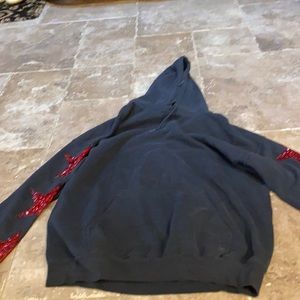 Emma and Sam black hoodie with red stars on sleeve